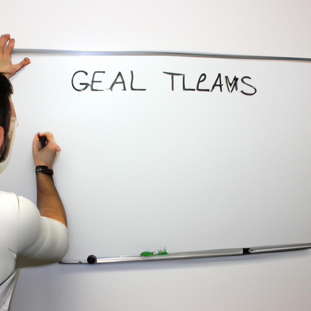 Coach writing goals on whiteboard